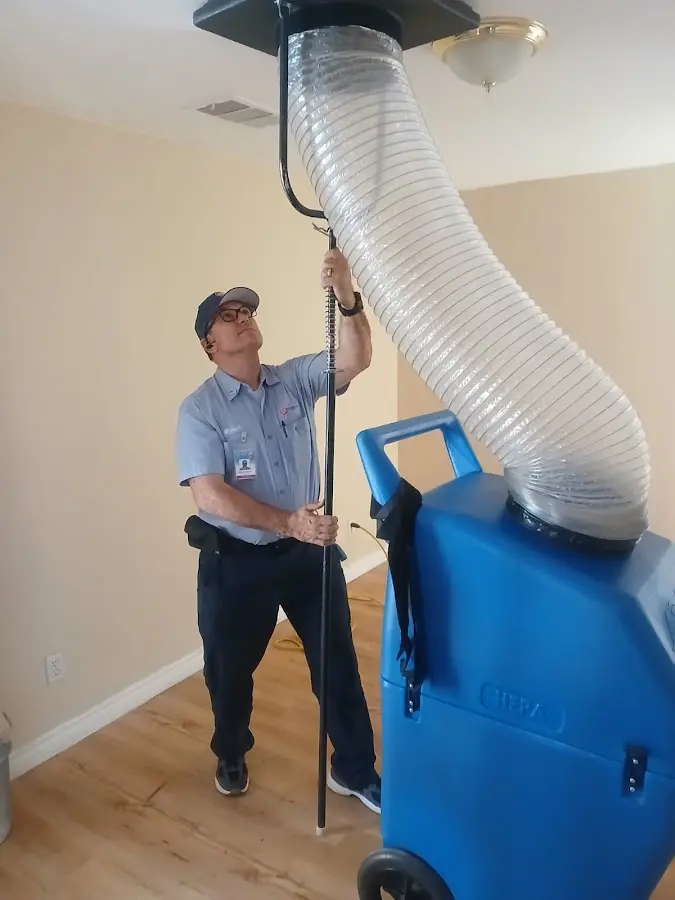 Mini Split Installation technician using HEPA equipment in DuPont